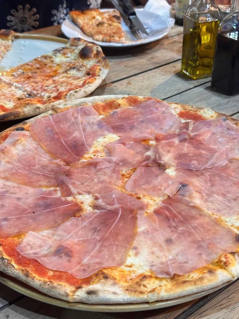 Authentic wood-fired Parma ham pizza at Agli Amici Phuket